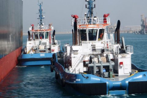 Tugboats appraoching vessel to assist entry into Ras Laffan Port